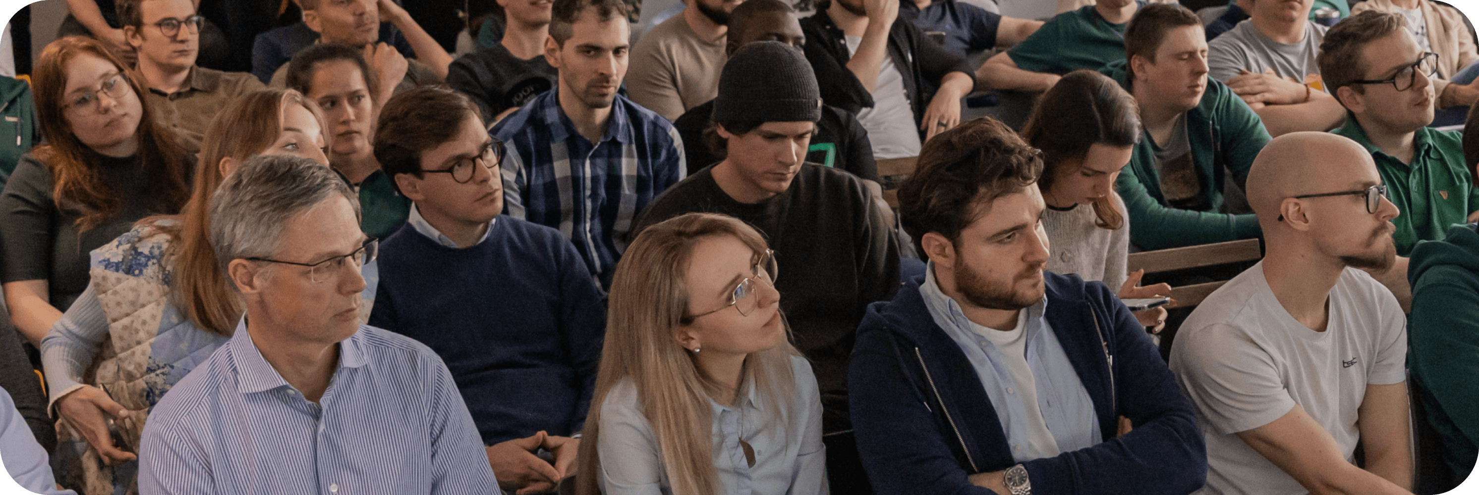 Audience listening attentively during a Tset company presentation