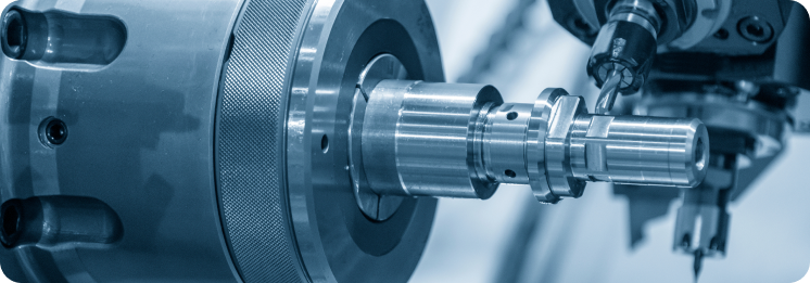 Close-up of a CNC machine drilling into a metal cylinder, emitting a precise, industrial tone. The machinery is highlighted in a cool, blue tint.