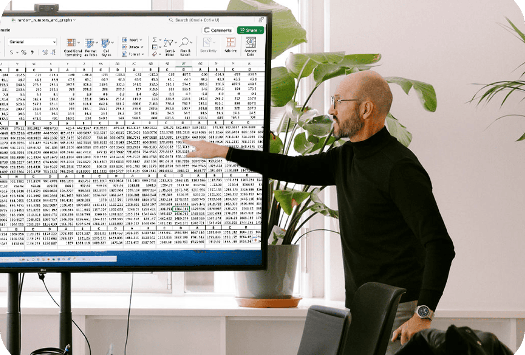 Manufacturing executive analyzing product cost data in Excel before transitioning to Tset’s cost optimization software.
